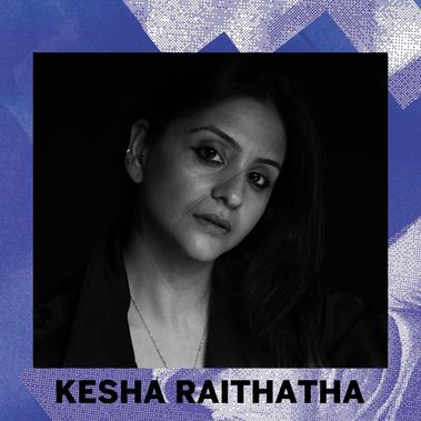 An image of Kesha Raithatha on a blue background with her name below. Image description: Black and white image of a woman, her head is tilted to the right and the image cuts off just under her shoulders. She is looking at the camera with a serious look.