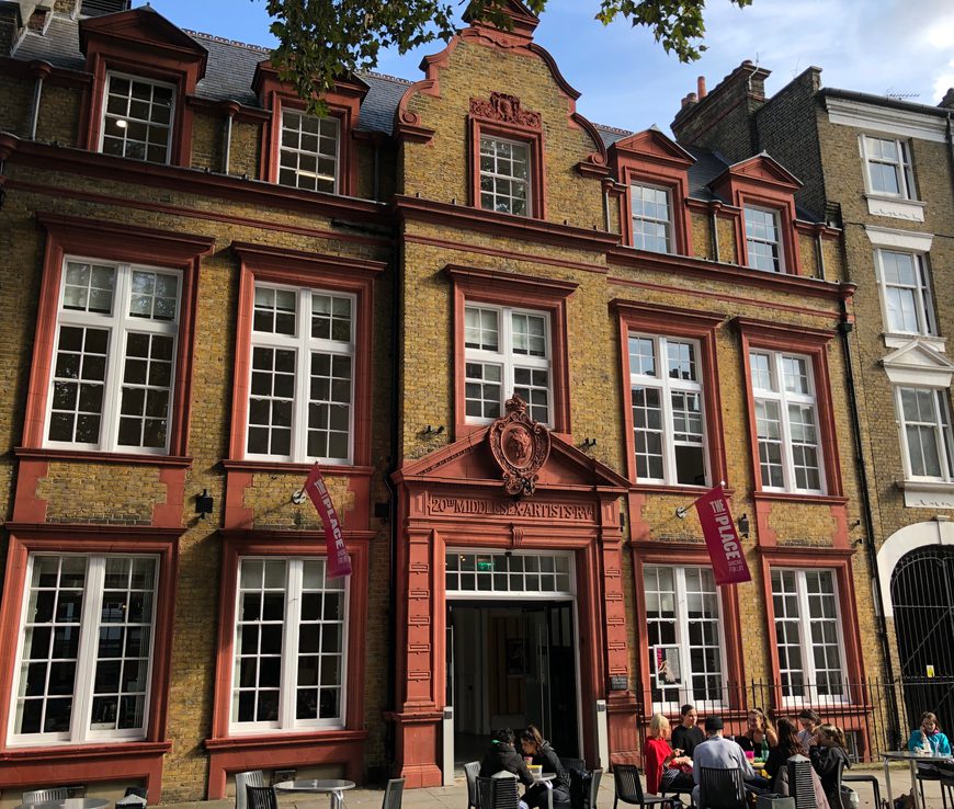 The Place building seen on a landscape picture from the front on a sunny day