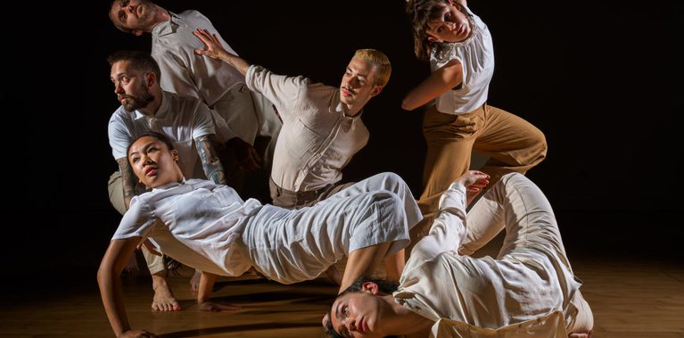 Dancers Joe Darby, Amy Morvell, Luke Brown, Yanki Ki Yau, Coralie Calfond, Ivan Merino Gaspar move as a group.